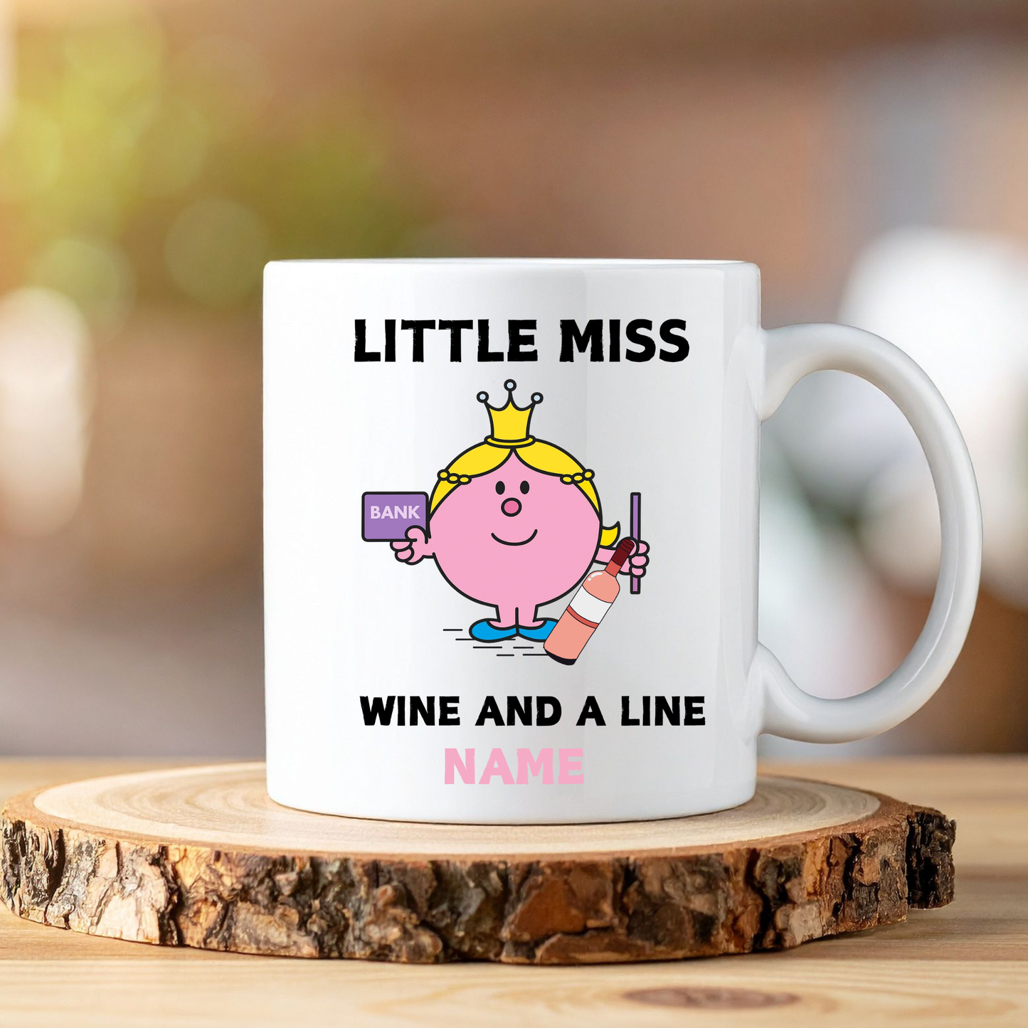 White mug with Little Miss Pink design and text on a wooden coaster